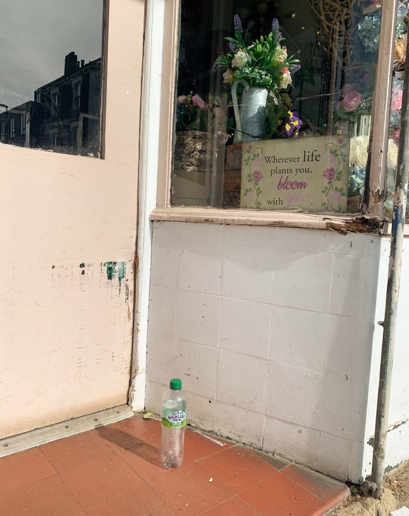 seltzer bottle on doorstep